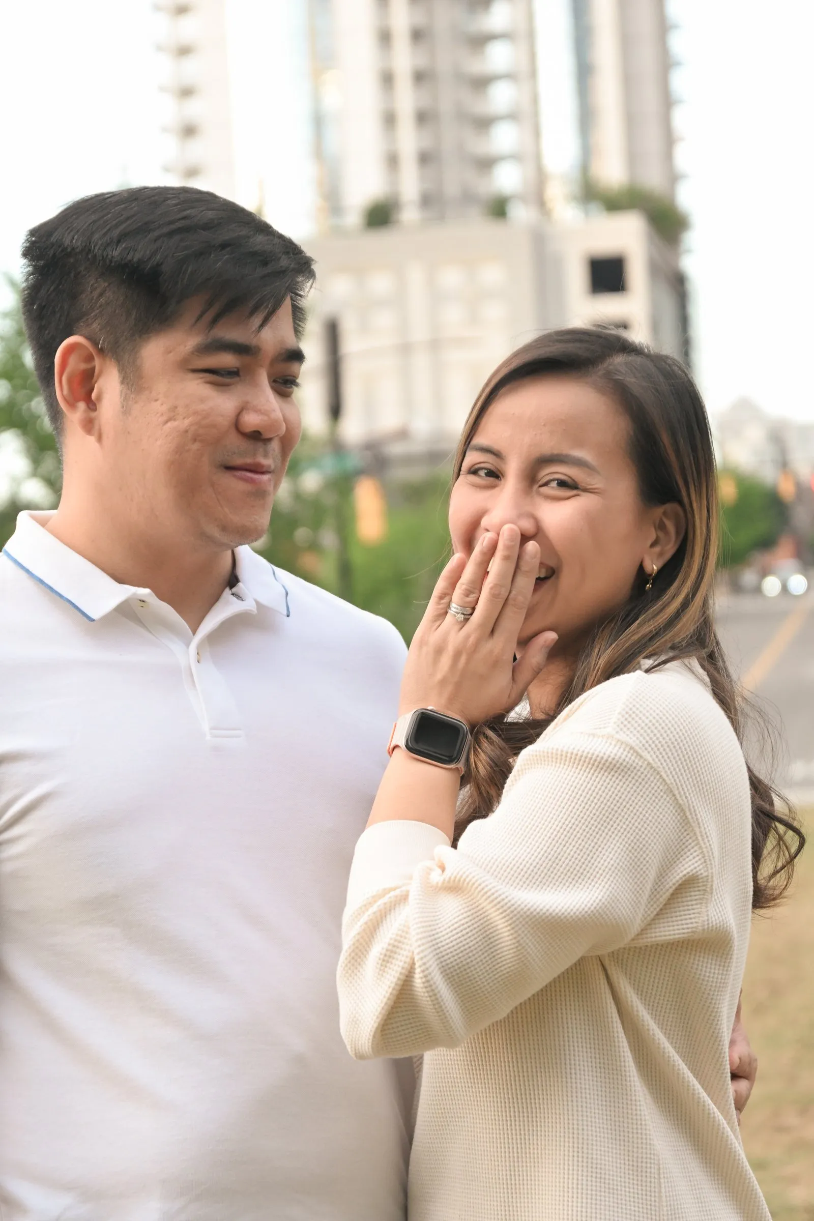 Jessica covers her laugh with her hand as Jet looks on