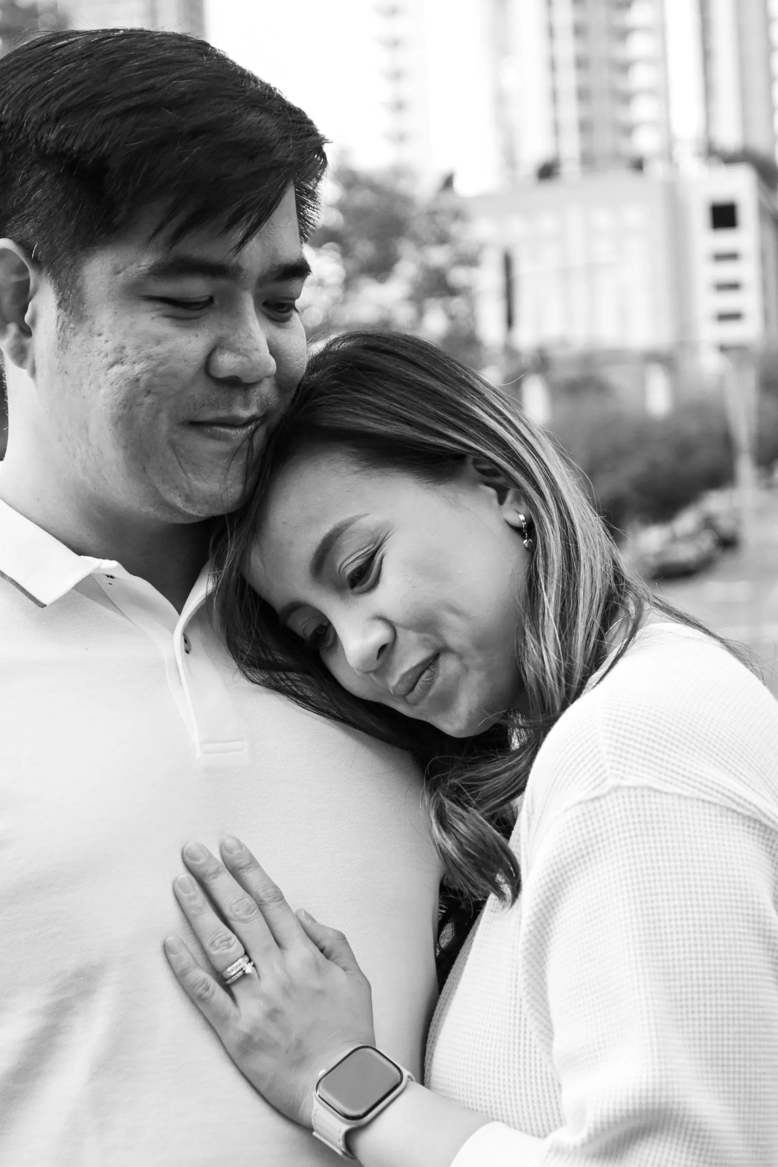 Black and white photograph of Jessica resting her head on Jet's chest