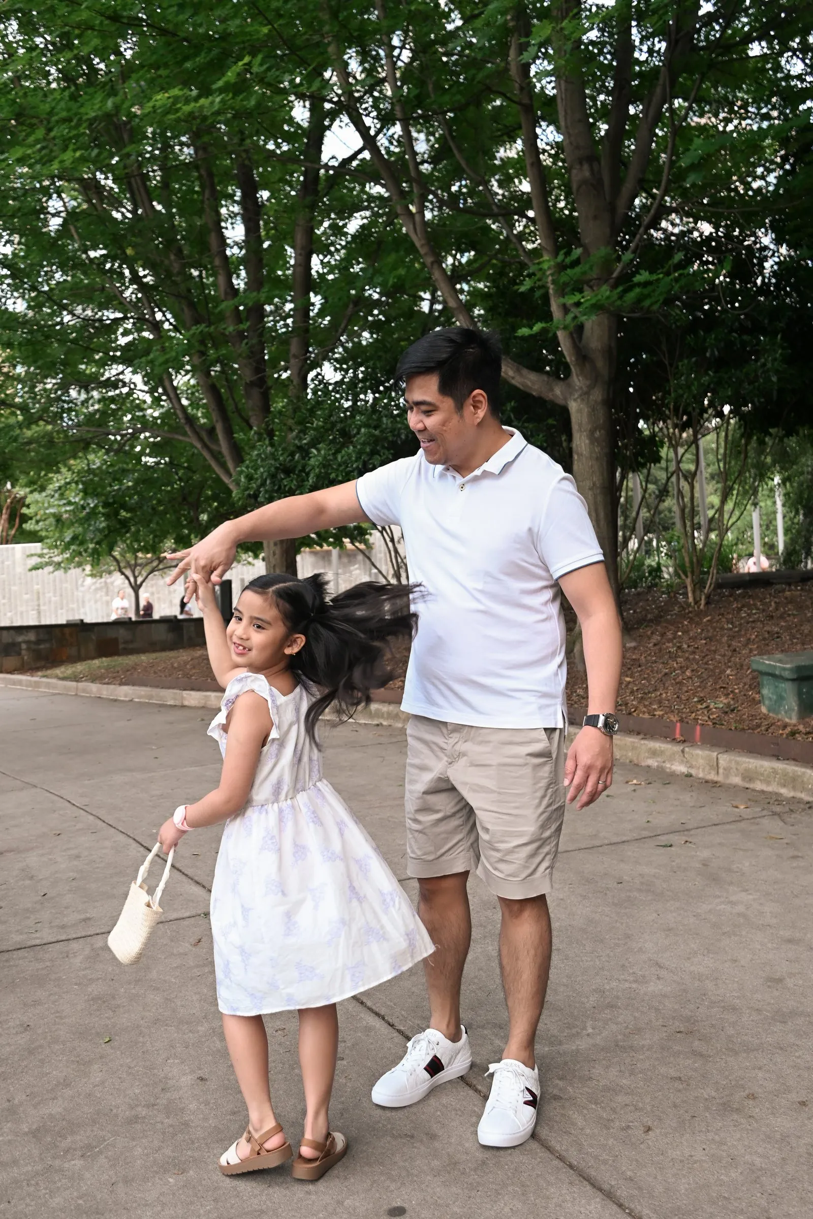 Mid-twirl, her hair flying as Jet holds her hand overhead