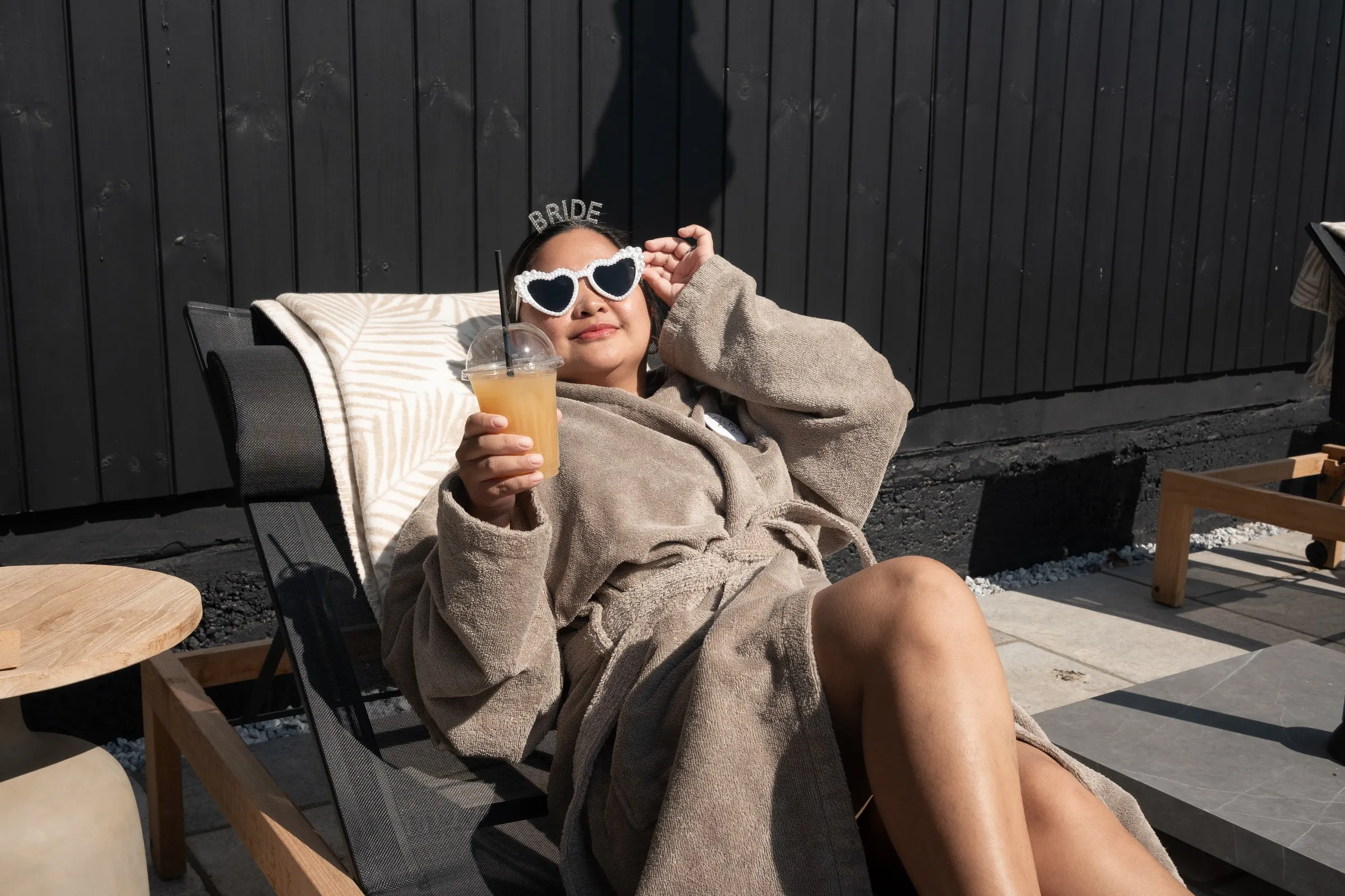Mathelle relaxing on a sun lounger with her cocktail