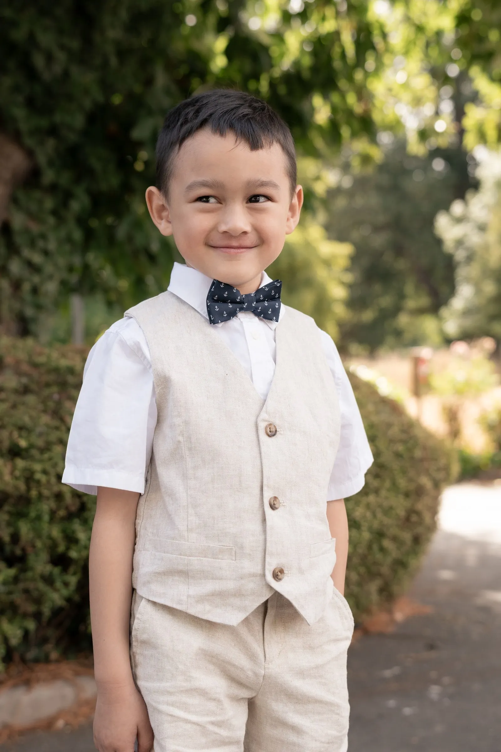 Mathelle's son standing tall in the garden at Rothley Court