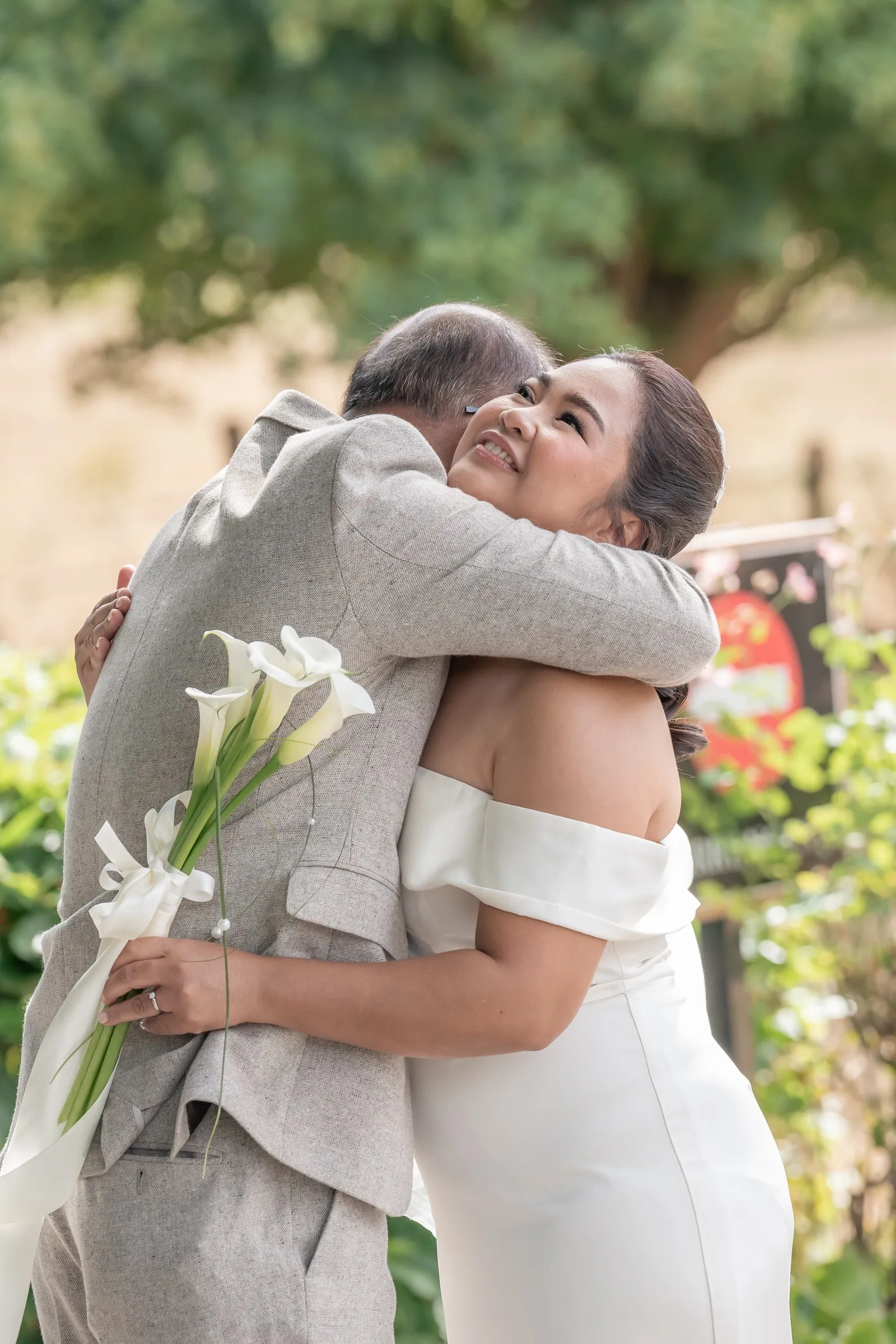 Mathelle hugging her dad, overcome with emotion during their first look at Rothley Court