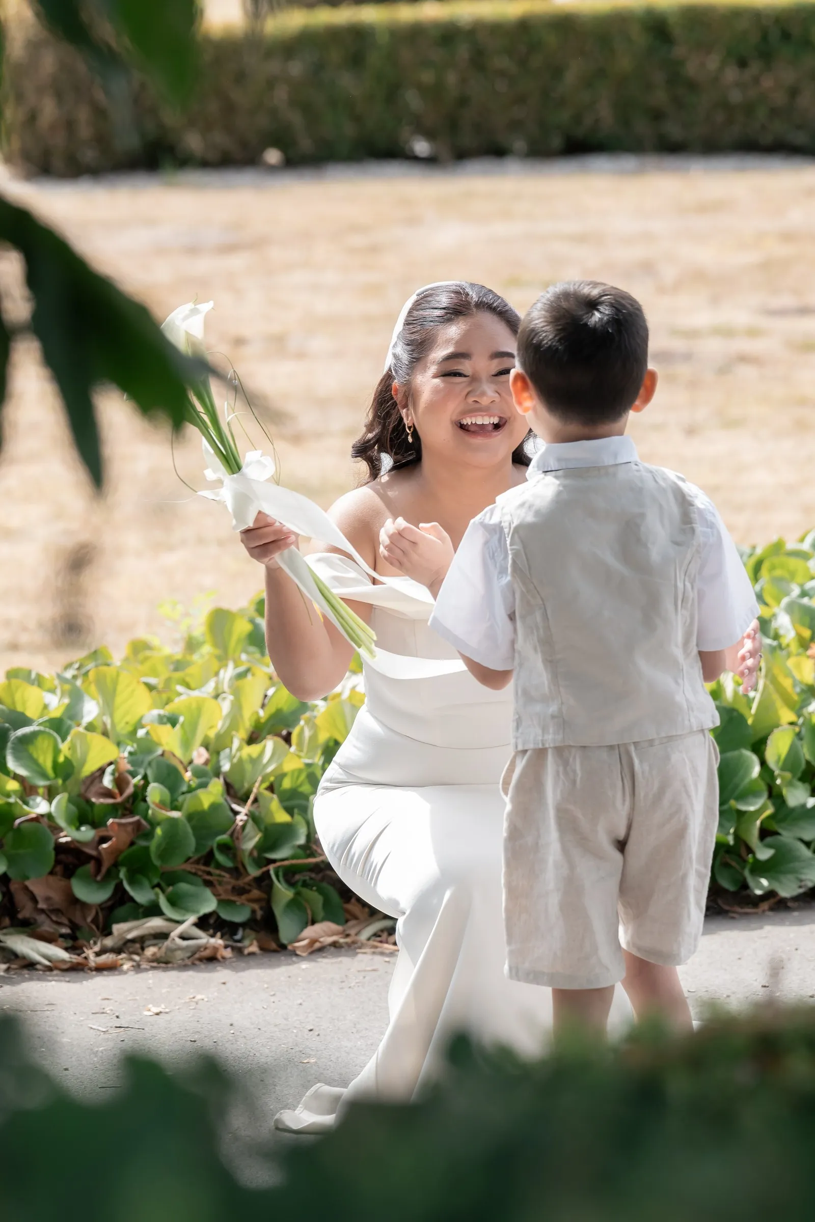 Mathelle laughing as her son reaches her during their first look