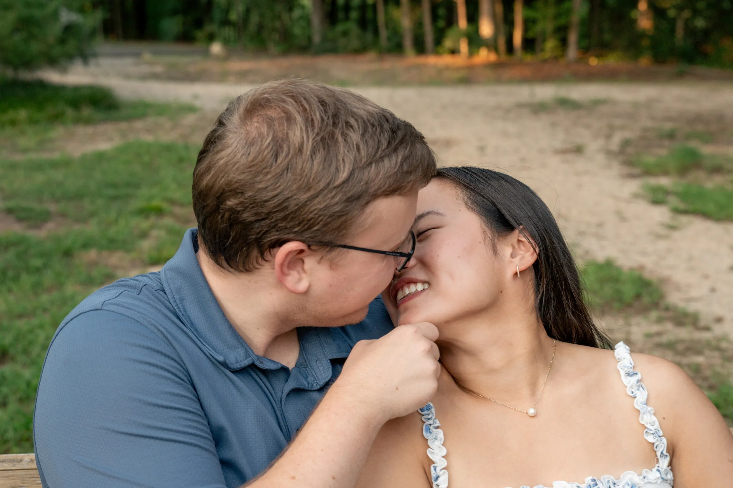Jacob pressing his cheek to Mya's as she laughs