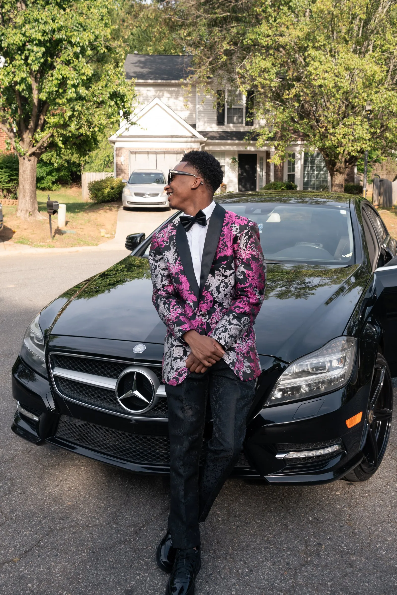 Low angle portrait against the front of the Mercedes