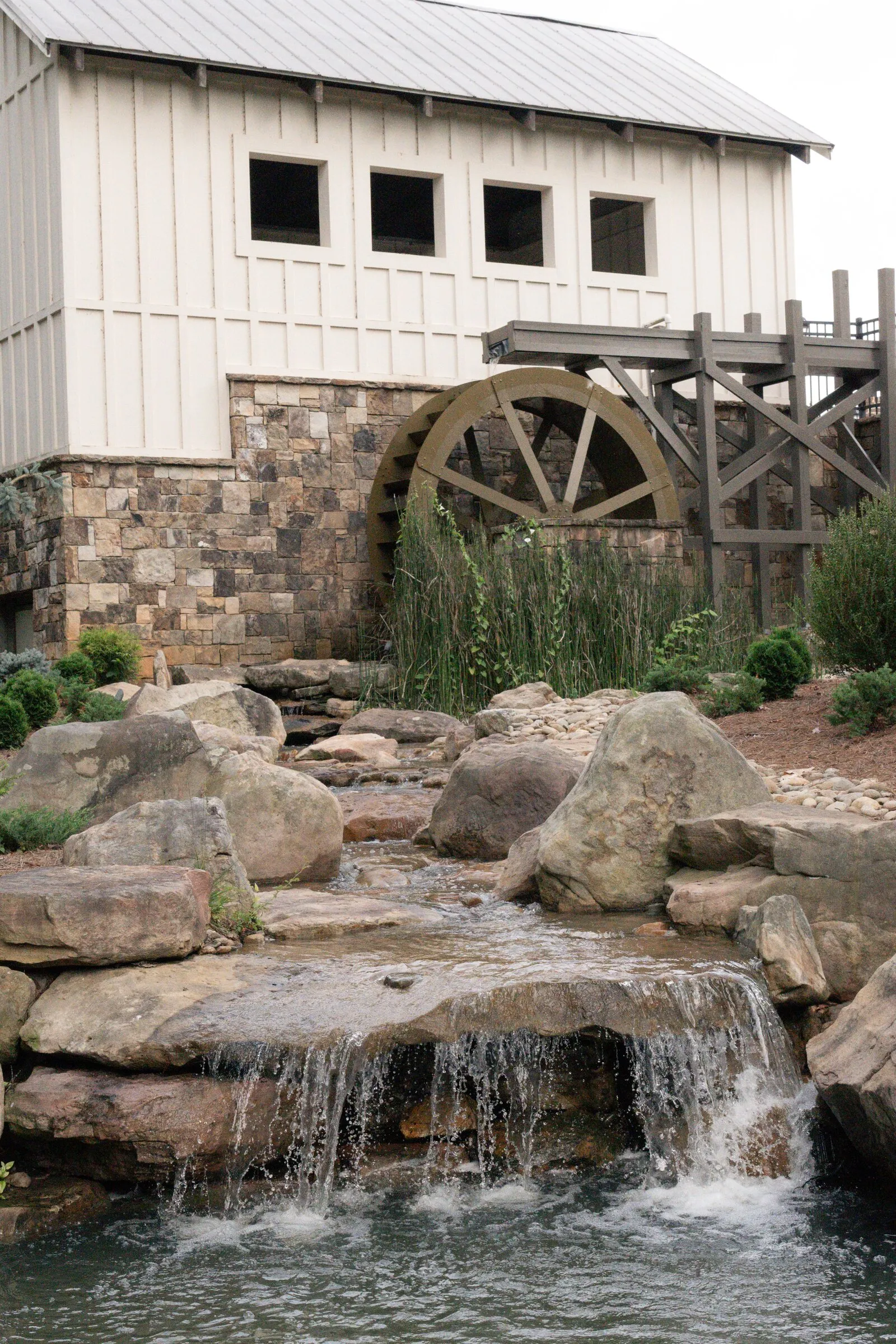 The Millbridge mill house and waterwheel above the rock waterfall